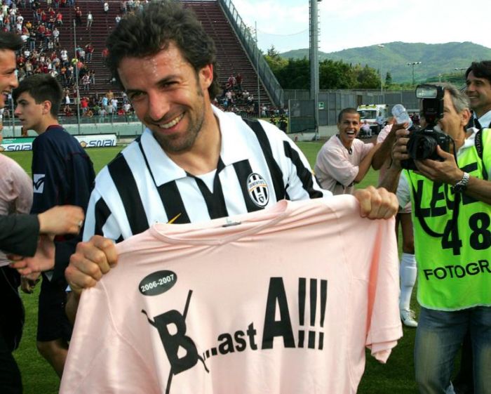 Juventus striker Alessandro Del Piero, center, followed by teammate Giorgio  Chiellini, left, with other teammates, warms-up next to an Italian Serie B  second division sign, at bottom, before the start of the